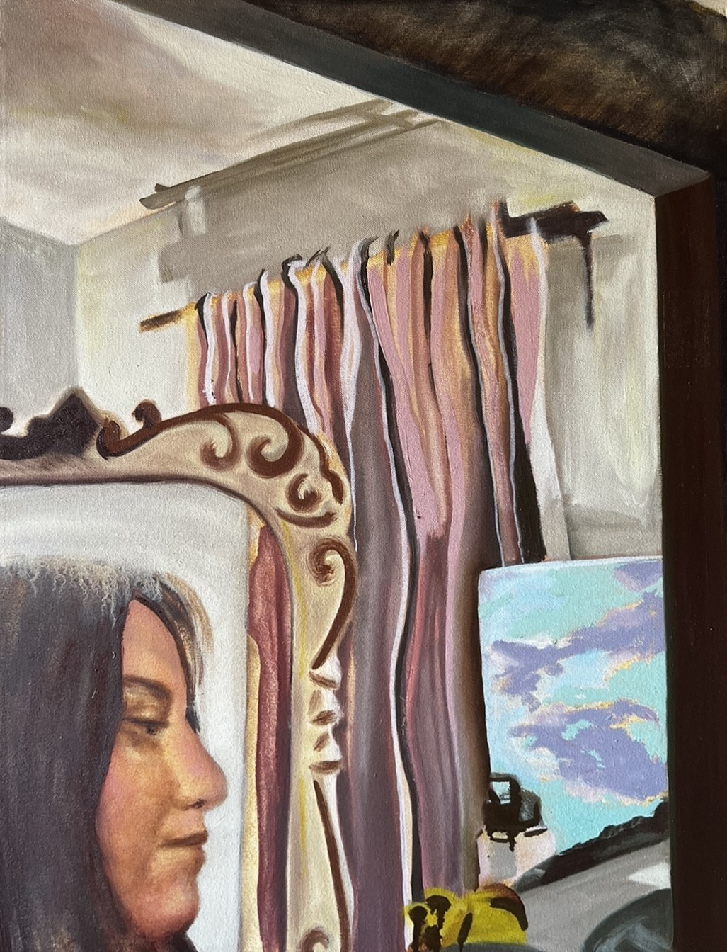 A woman's face appears in a mirror in the bottom left corner of a room